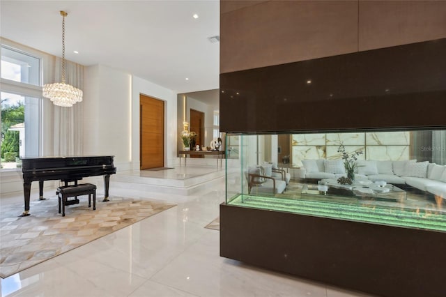 interior space featuring an inviting chandelier and a towering ceiling