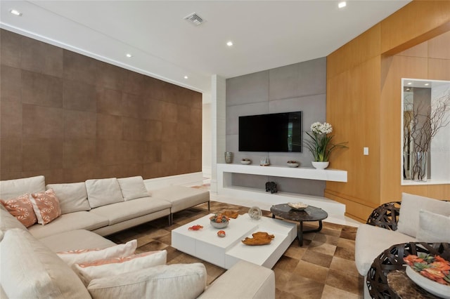 tiled living room featuring tile walls