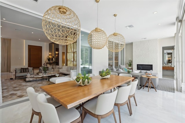 tiled dining space featuring a fireplace