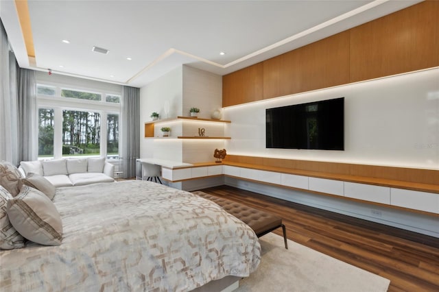 bedroom with hardwood / wood-style flooring