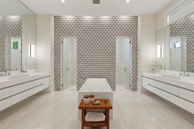 bathroom with tile patterned flooring and tile walls