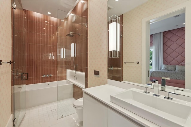 bathroom featuring tile patterned flooring, an enclosed shower, vanity, and toilet