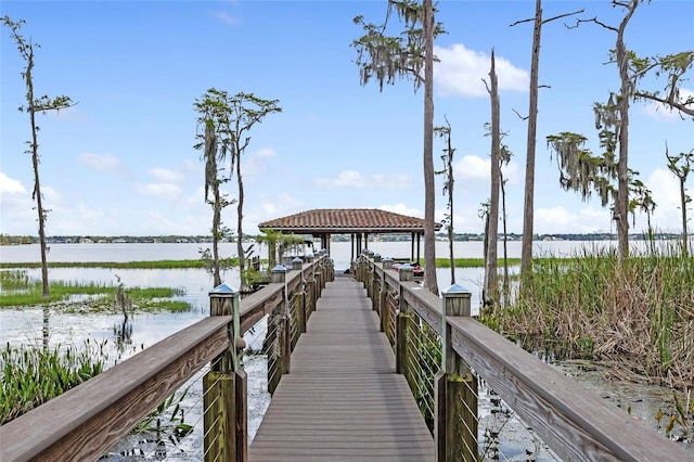 dock area with a gazebo and a water view