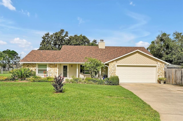 ranch-style home with a garage and a front lawn