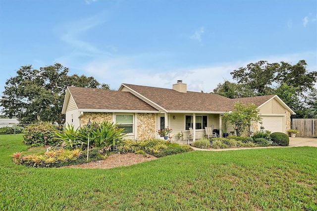 ranch-style house with a front yard and a garage