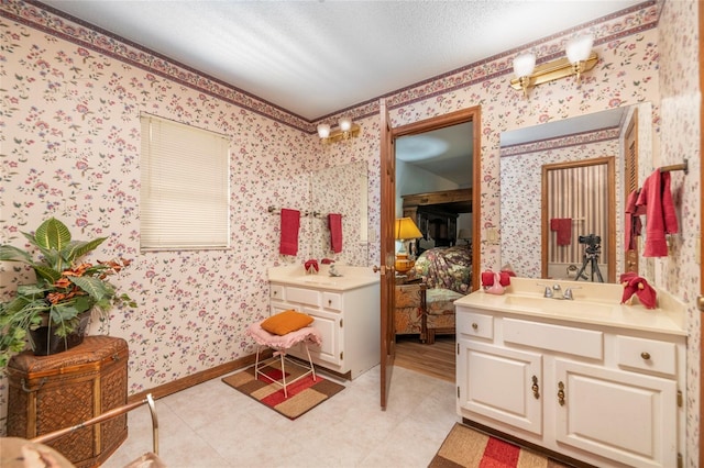 bathroom featuring vanity and a textured ceiling