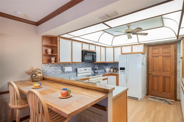 kitchen with white cabinetry, kitchen peninsula, ornamental molding, white appliances, and light hardwood / wood-style flooring