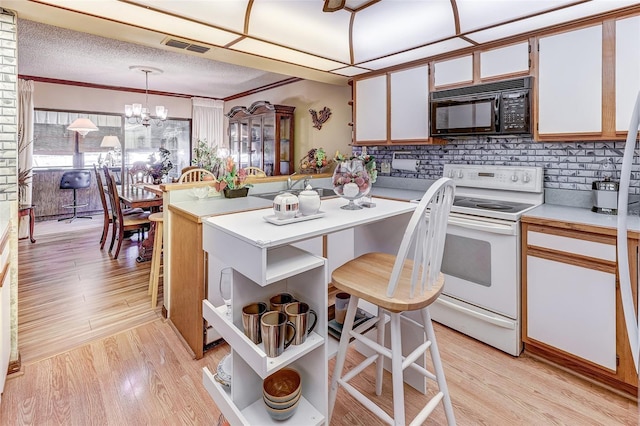 1546 Stormway Ct, Apopka, FL 32712 - kitchen with black microwave, white electric range oven, open shelves, light countertops, and backsplash