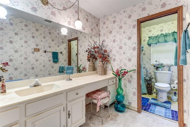 1546 Stormway Ct, Apopka, FL 32712 - bathroom with vanity, tile patterned flooring, a textured ceiling, wallpapered walls, and toilet