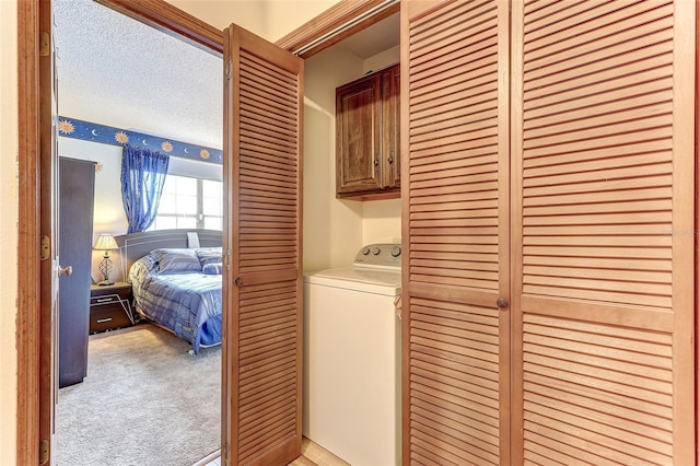 1546 Stormway Ct, Apopka, FL 32712 - clothes washing area featuring washer / dryer, cabinet space, and light carpet
