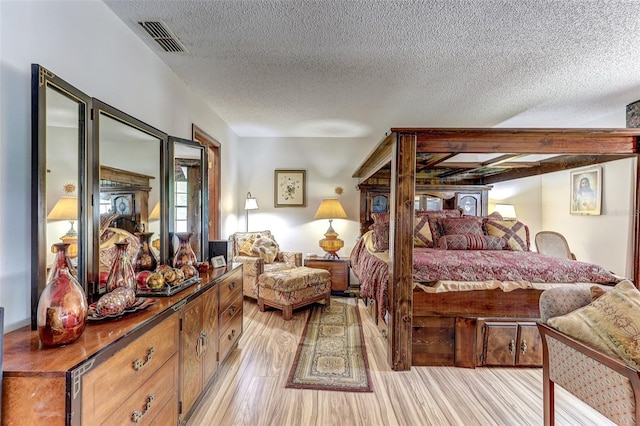 1546 Stormway Ct, Apopka, FL 32712 - bedroom with a textured ceiling and light wood-style flooring