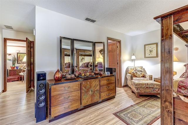 1546 Stormway Ct, Apopka, FL 32712 - sitting room with light wood-style flooring and a textured ceiling