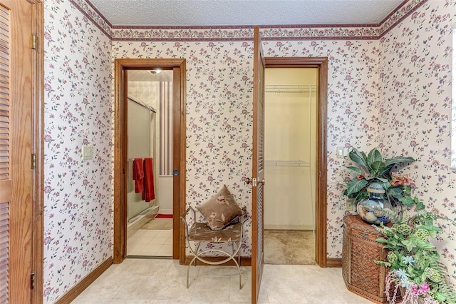 1546 Stormway Ct, Apopka, FL 32712 - hallway featuring wallpapered walls, light tile patterned floors, and baseboards