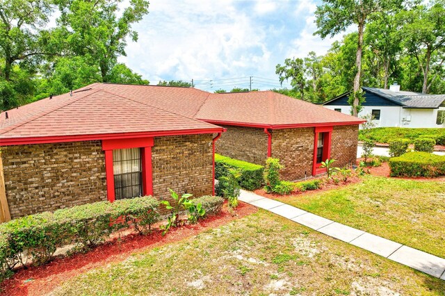 1546 Stormway Ct, Apopka, FL 32712 - single story home featuring brick siding, a front lawn, and a shingled roof