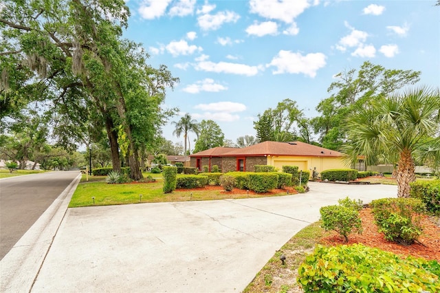 1546 Stormway Ct, Apopka, FL 32712 - ranch-style house featuring concrete driveway, an attached garage, and stucco siding