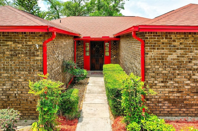 1546 Stormway Ct, Apopka, FL 32712 - property entrance featuring brick siding and roof with shingles
