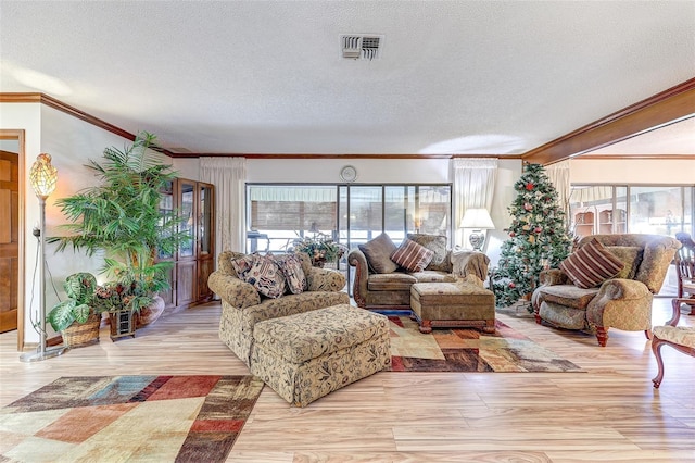 1546 Stormway Ct, Apopka, FL 32712 - living area featuring ornamental molding, plenty of natural light, a textured ceiling, and light wood-style floors