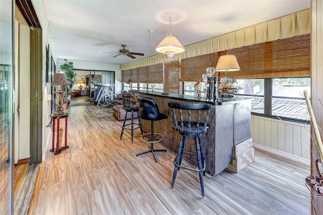1546 Stormway Ct, Apopka, FL 32712 - kitchen with light wood-type flooring, healthy amount of natural light, and a breakfast bar area