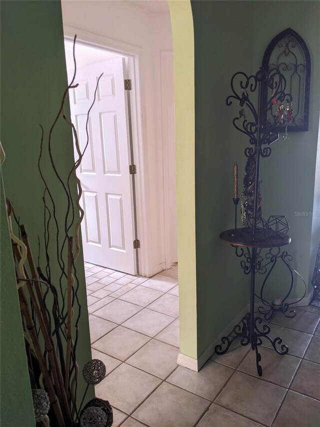 hall with light tile patterned flooring