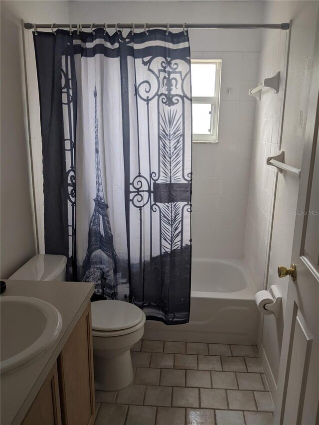 full bathroom featuring vanity, toilet, shower / tub combo with curtain, and tile patterned floors