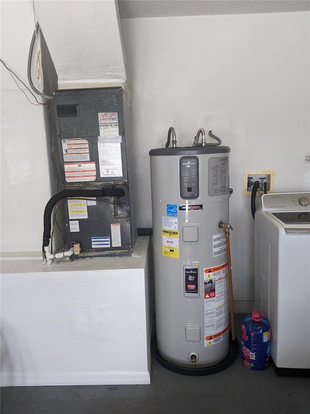 utilities featuring washer / dryer, hybrid water heater, and heating unit