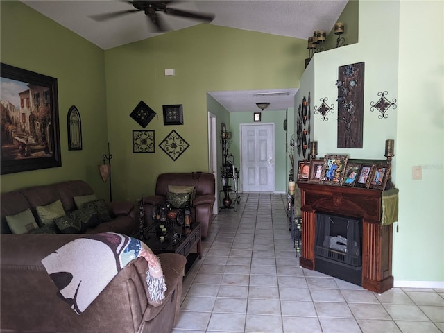 living room with lofted ceiling, light tile patterned floors, and ceiling fan