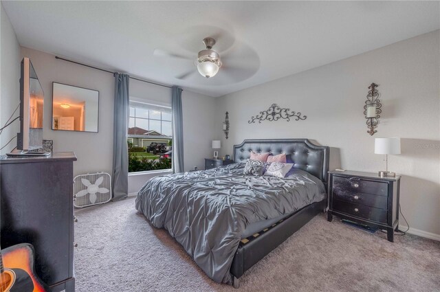 bedroom featuring ceiling fan and carpet flooring