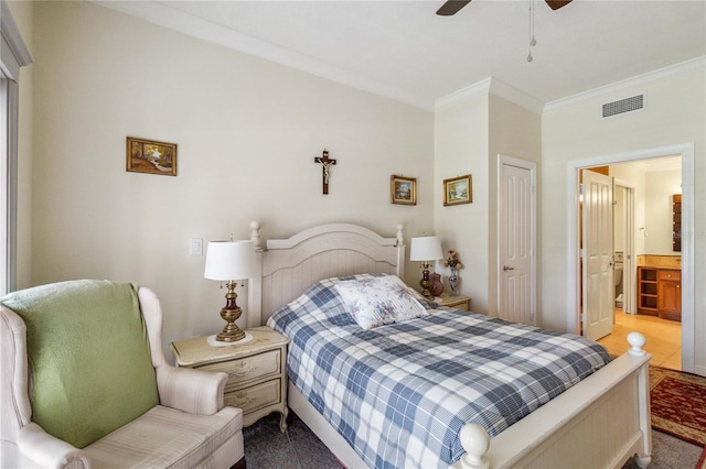 tiled bedroom featuring ceiling fan, ornamental molding, a closet, and ensuite bath