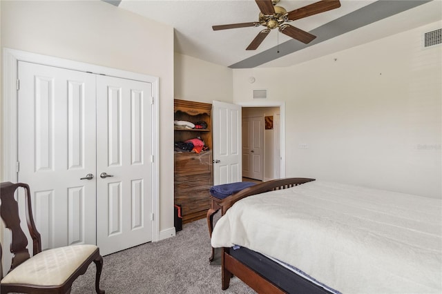 bedroom with a closet, ceiling fan, and light colored carpet