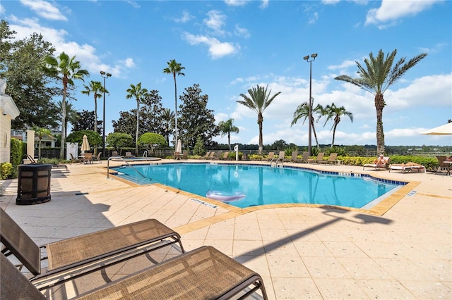 view of swimming pool featuring a patio