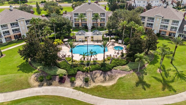 view of pool with a yard