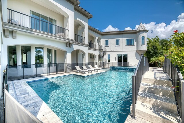 view of swimming pool featuring a patio area