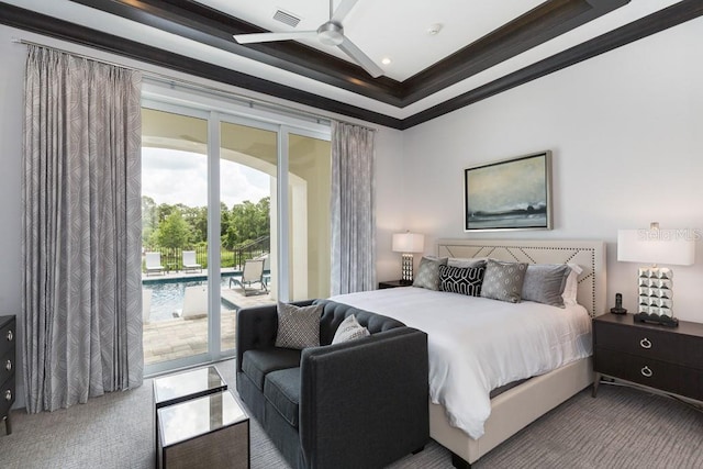 bedroom featuring ceiling fan, access to outside, and a raised ceiling