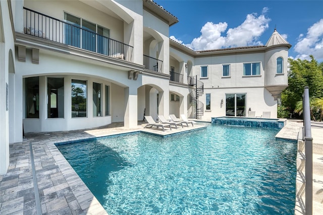 exterior space featuring a patio and a balcony