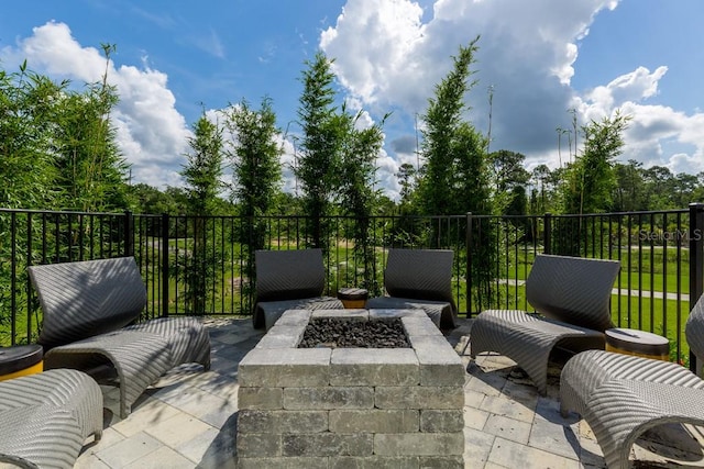 view of patio / terrace featuring a fire pit