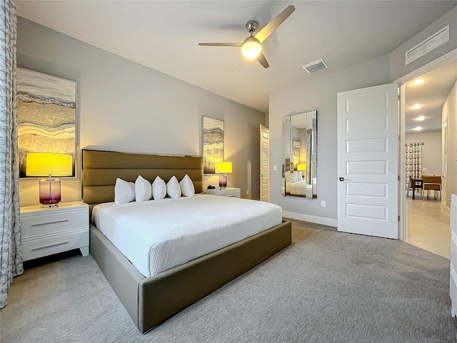 carpeted bedroom featuring ceiling fan