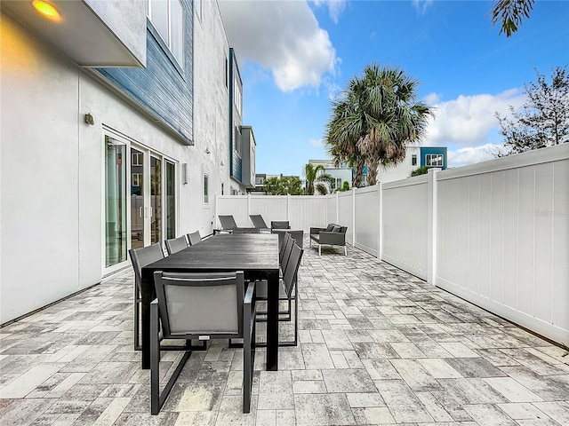 view of patio featuring outdoor dining space, a fenced backyard, and outdoor lounge area