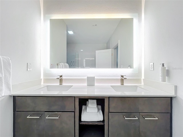 full bathroom with double vanity and a sink