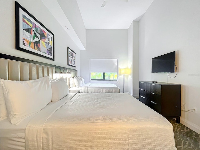 bedroom with carpet flooring and baseboards