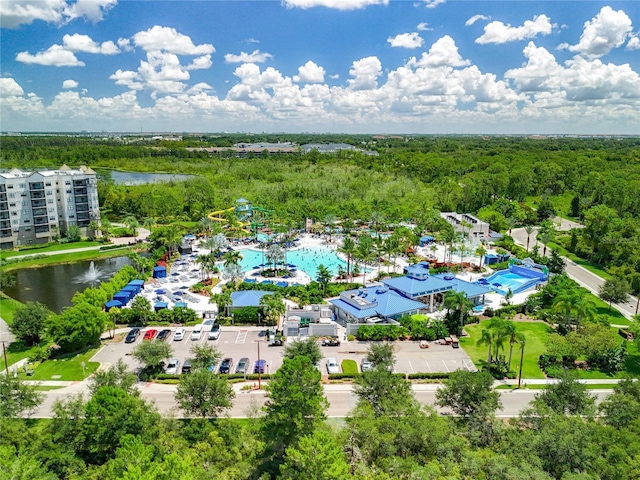 birds eye view of property featuring a water view and a forest view