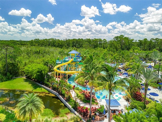 birds eye view of property featuring a view of trees