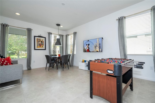 rec room with plenty of natural light and light tile patterned flooring