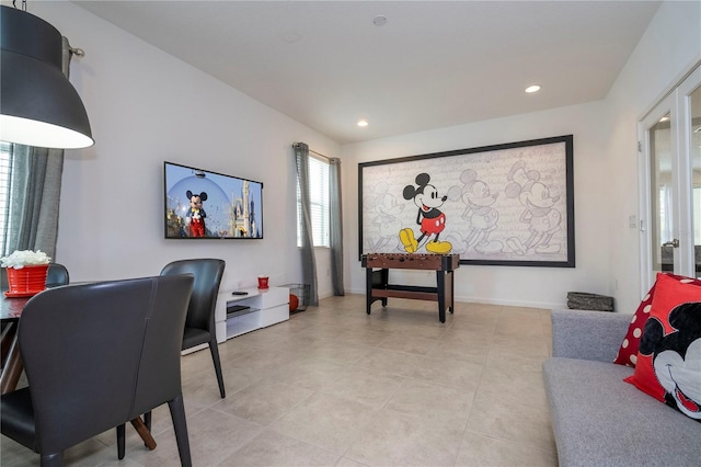 interior space with light tile patterned floors, baseboards, and recessed lighting