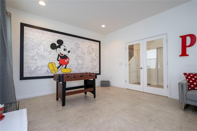 recreation room with recessed lighting, french doors, light tile patterned flooring, and baseboards