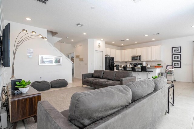 living room featuring light tile patterned floors