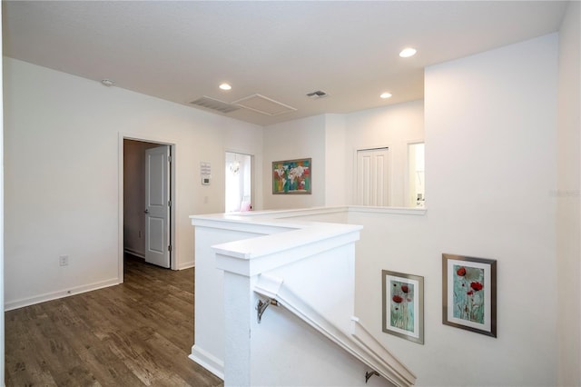 hall with visible vents, dark wood-style floors, an upstairs landing, and recessed lighting