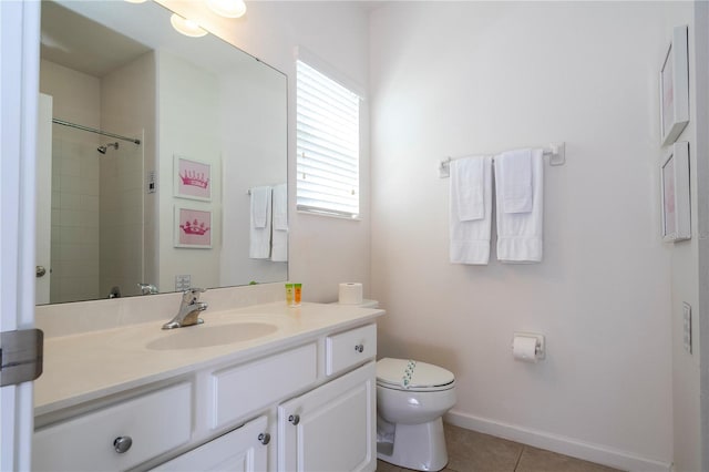 bathroom featuring tile patterned flooring, toilet, and vanity