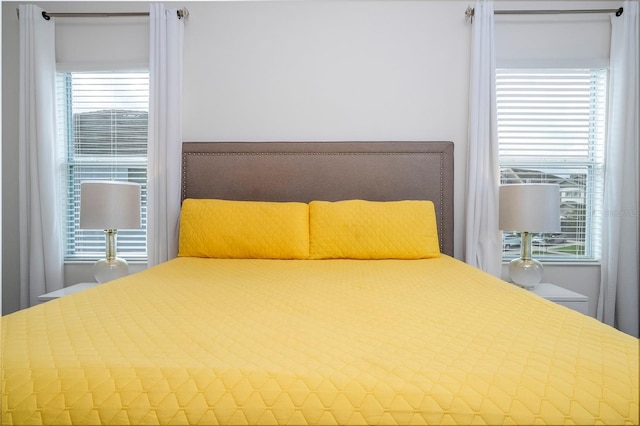 unfurnished bedroom featuring multiple windows