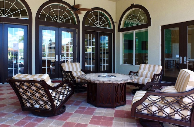 view of patio / terrace with a ceiling fan and french doors