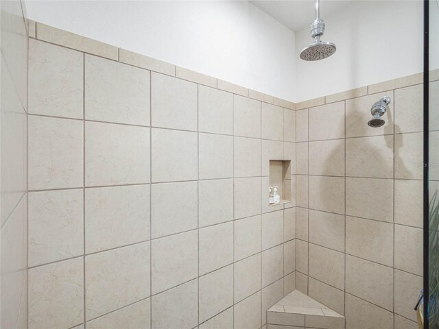 bathroom with a tile shower